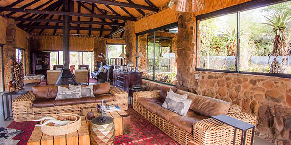 The Main Lodge lounge and deck area at Leopard Mountain Game Lodge, in the Big 5 Manyoni Private Game Reserve