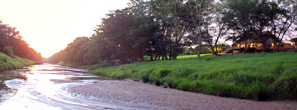 View of river and the Main Lodge at Rhino River Lodge in the Manyoni Private Game Reserve (previously the Zululand Rhino Reserve), a Big 5 Reserve in KwaZulu-Natal Rhino River Lodge Main Lodge River Zululand Rhino Reserve KwaZulu-Natal South Africa