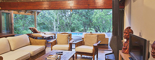 The Homestead, Lounge looking onto the Deck area at Rhino River Lodge in the Big 5 Manyoni Private Game Reserve (Zululand Rhino Reserve) located in KwaZulu-Natal, South Africa